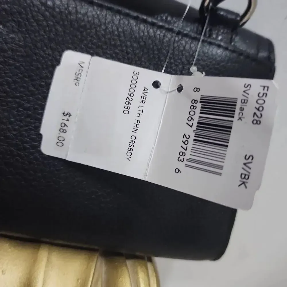 Coach Avery leather phone crossbody w/ a flap closure.